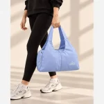 ساک ورزشی و استخری پارچه ای با 5 جیب بیرونی ابعاد 41 در 27 سانتیمتر - تصویر 2