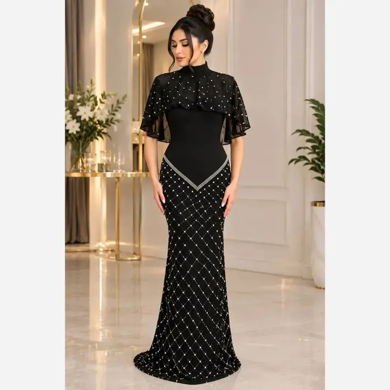 8d70b6f7-463f-486f-9148-d8d49c73ff4a ماکسی مجلسی پریسیما جنس کرپ دالقیچ و حریر مروارید و نگین دار رنگ سرمه ای و مشکی - تصویر 1